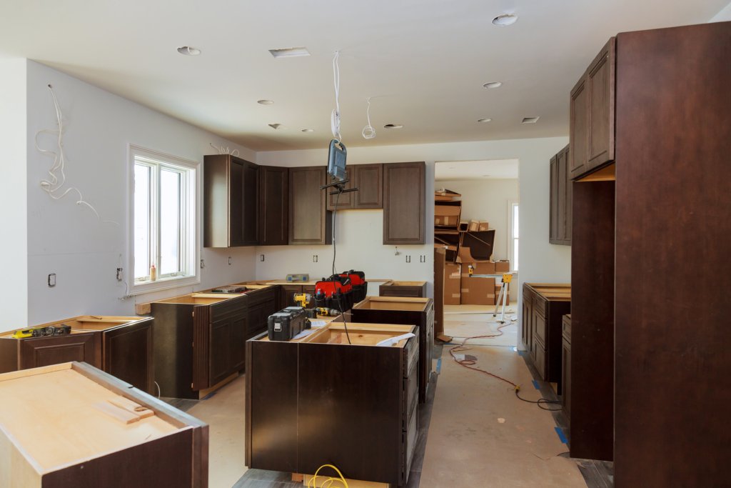 Installing new modern kitchen of preparing to custom installation process assembling furniture