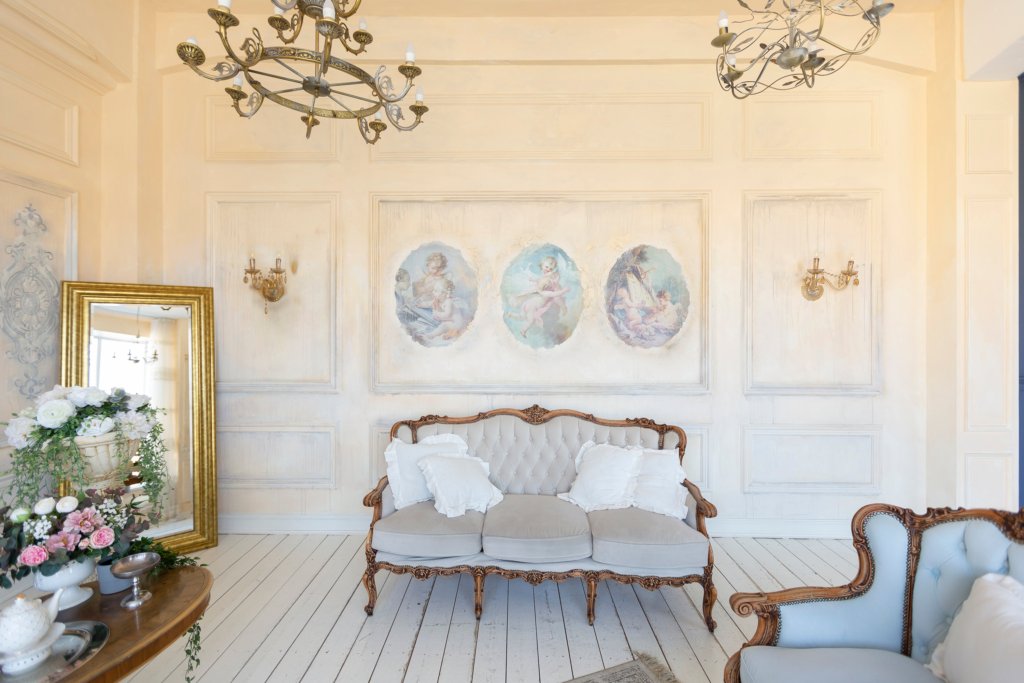 luluxury rich sitting room interior in beige pastel color with antique expensive furniture in baroque style. walls decorated with stucco and frescoes